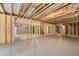 Large unfinished basement with exposed insulation and wooden framing. Awaiting customization at 55 Black Rock Rdg, Sharpsburg, GA 30277