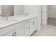 Bright bathroom features double sinks, vanity with white cabinets, and chrome hardware at 55 Black Rock Rdg, Sharpsburg, GA 30277