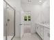 Bright bathroom features a tiled shower and double sink vanity at 55 Black Rock Rdg, Sharpsburg, GA 30277