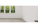 Carpeted bedroom with a large window and natural light at 55 Black Rock Rdg, Sharpsburg, GA 30277