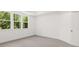 Carpeted bedroom with a large window and natural light at 55 Black Rock Rdg, Sharpsburg, GA 30277