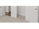 Hallway leading to a bedroom with gray carpet at 55 Black Rock Rdg, Sharpsburg, GA 30277
