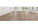 Open-concept living area with a kitchen island and wood-look floors at 55 Black Rock Rdg, Sharpsburg, GA 30277