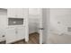 View of the pantry with wire shelving adjacent to the laundry room at 55 Black Rock Rdg, Sharpsburg, GA 30277