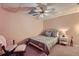 Cozy bedroom with neutral walls, fan, and carpet, plus a comfortable twin bed at 3314 Eagle Watch Dr, Woodstock, GA 30189
