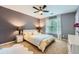 Nicely decorated bedroom with a large window, ceiling fan and soft neutral colors at 3314 Eagle Watch Dr, Woodstock, GA 30189