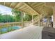 Covered deck overlooking a swimming pool, perfect for outdoor entertaining at 3314 Eagle Watch Dr, Woodstock, GA 30189