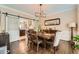 Charming dining room with modern lighting, hardwood floors, and sliding doors at 3314 Eagle Watch Dr, Woodstock, GA 30189