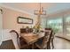 Elegant dining room featuring hardwood floors, stylish chairs, and large window at 3314 Eagle Watch Dr, Woodstock, GA 30189