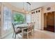 Charming dining room featuring a window view, chandelier, and cabinet space at 3314 Eagle Watch Dr, Woodstock, GA 30189