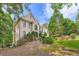 This elegant home is set in a serene landscape with lush greenery and mature trees at 3314 Eagle Watch Dr, Woodstock, GA 30189