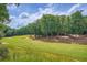 Picture of a lush community golf course on a sunny day at 3314 Eagle Watch Dr, Woodstock, GA 30189