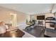 Spacious home gym area with a sofa, gym equipment, and large TV at 3314 Eagle Watch Dr, Woodstock, GA 30189