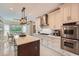 Bright eat-in kitchen featuring an island, stainless steel appliances, and plenty of cabinet space at 3314 Eagle Watch Dr, Woodstock, GA 30189