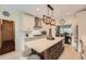 Bright eat-in kitchen featuring an island, tile backsplash, stainless steel appliances, and pendant lighting at 3314 Eagle Watch Dr, Woodstock, GA 30189