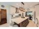 Bright kitchen features a large center island, stainless appliances, and modern pendant lighting at 3314 Eagle Watch Dr, Woodstock, GA 30189
