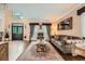 Elegant living room featuring hardwood floors, comfortable seating, and sophisticated decor at 3314 Eagle Watch Dr, Woodstock, GA 30189