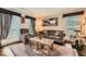 Inviting living room featuring a comfortable seating arrangement, detailed rug, and soft natural light at 3314 Eagle Watch Dr, Woodstock, GA 30189