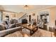 Spacious living room featuring hardwood floors, natural light, and comfortable seating at 3314 Eagle Watch Dr, Woodstock, GA 30189