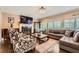 Cozy living room featuring a fireplace, hardwood floors, and comfortable seating at 3314 Eagle Watch Dr, Woodstock, GA 30189