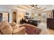 Tranquil main bedroom with a tray ceiling, sitting area, and en-suite bathroom access at 3314 Eagle Watch Dr, Woodstock, GA 30189
