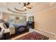 Comfortable main bedroom features a trey ceiling, ceiling fan, and complementary decor at 3314 Eagle Watch Dr, Woodstock, GA 30189
