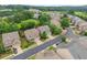Aerial view of neighborhood with houses, mature trees, and green grass at 5901 Cobblestone Creek Cir, Mableton, GA 30126