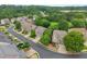 View of the neighborhood street with well-manicured lawns and mature trees at 5901 Cobblestone Creek Cir, Mableton, GA 30126