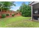 View of the backyard with a wooden fence and mulch at 5901 Cobblestone Creek Cir, Mableton, GA 30126