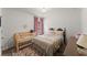 Charming bedroom featuring a crib and a cozy double bed with plush bedding at 5901 Cobblestone Creek Cir, Mableton, GA 30126