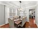 Dining area with a modern chandelier and seating for six at 5901 Cobblestone Creek Cir, Mableton, GA 30126