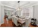 Dining room with elegant seating and view into the living area at 5901 Cobblestone Creek Cir, Mableton, GA 30126