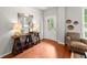 Inviting foyer with hardwood floors, a console table, lamps, and decorative elements at 5901 Cobblestone Creek Cir, Mableton, GA 30126
