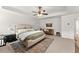 Bright main bedroom features a large bed, soft rug, and contemporary furnishings at 5901 Cobblestone Creek Cir, Mableton, GA 30126