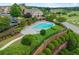 Beautiful community pool with lounge chairs and well-maintained landscaping; elevated view adds privacy at 5901 Cobblestone Creek Cir, Mableton, GA 30126