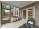 Inviting screened porch with comfortable seating and a view of the backyard at 5901 Cobblestone Creek Cir, Mableton, GA 30126