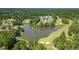 Stunning aerial of lakefront property with golf course, creating a picturesque and tranquil setting at 9634 Coastal Pointe Dr, Villa Rica, GA 30180