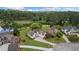 Aerial shot showcases golf course homes with pristine lawns and picturesque pond views at 9634 Coastal Pointe Dr, Villa Rica, GA 30180