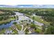 Breathtaking aerial view of a golf course community with homes surrounding a pristine lake at 9634 Coastal Pointe Dr, Villa Rica, GA 30180