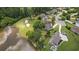Aerial image showcasing lakeside homes with pools, landscaping, and a beautiful view of the golf course at 9634 Coastal Pointe Dr, Villa Rica, GA 30180
