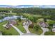 An aerial view of lakeside homes with manicured lawns and an adjacent golf course at 9634 Coastal Pointe Dr, Villa Rica, GA 30180