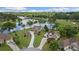 Stunning aerial view of lakeside homes and a golf course, nestled in lush greenery at 9634 Coastal Pointe Dr, Villa Rica, GA 30180