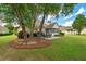 Landscaped backyard with seating and outdoor fire pit at 9634 Coastal Pointe Dr, Villa Rica, GA 30180
