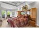 Cozy bedroom featuring a decorative headboard, a bay window, and wood flooring at 9634 Coastal Pointe Dr, Villa Rica, GA 30180
