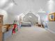 Bright bonus room with neutral carpet, vaulted ceiling, and natural light at 9634 Coastal Pointe Dr, Villa Rica, GA 30180