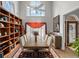 Formal dining room with high ceilings, custom shelving and an abundance of natural light at 9634 Coastal Pointe Dr, Villa Rica, GA 30180