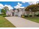 Charming two-story home with a well-manicured lawn, three-car garage, and inviting curb appeal at 9634 Coastal Pointe Dr, Villa Rica, GA 30180