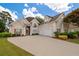 Charming two-story home with a well-manicured lawn, three-car garage, and inviting curb appeal at 9634 Coastal Pointe Dr, Villa Rica, GA 30180