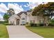 Charming two-story home with a well-manicured lawn and inviting curb appeal with mature tree at 9634 Coastal Pointe Dr, Villa Rica, GA 30180