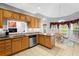 Well-lit kitchen with granite counters, stainless appliances, and a bright breakfast nook at 9634 Coastal Pointe Dr, Villa Rica, GA 30180